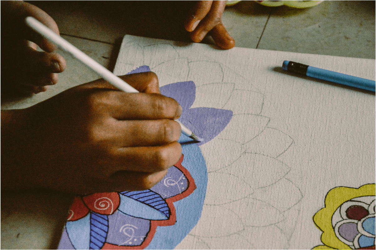 How to Make Money on Amazon Without Selling. A Person Painting a Design on Canvas. How to make money on Amazon without selling . A person painting a design on a canvas, their hand
is visible.