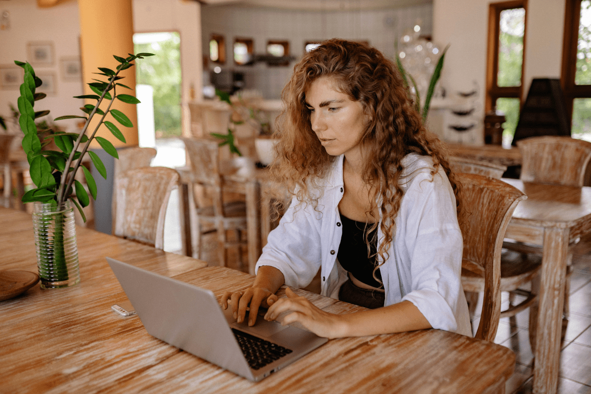 A Women Working On Her Laptop Showing How to Create Digital Products to Sell Online