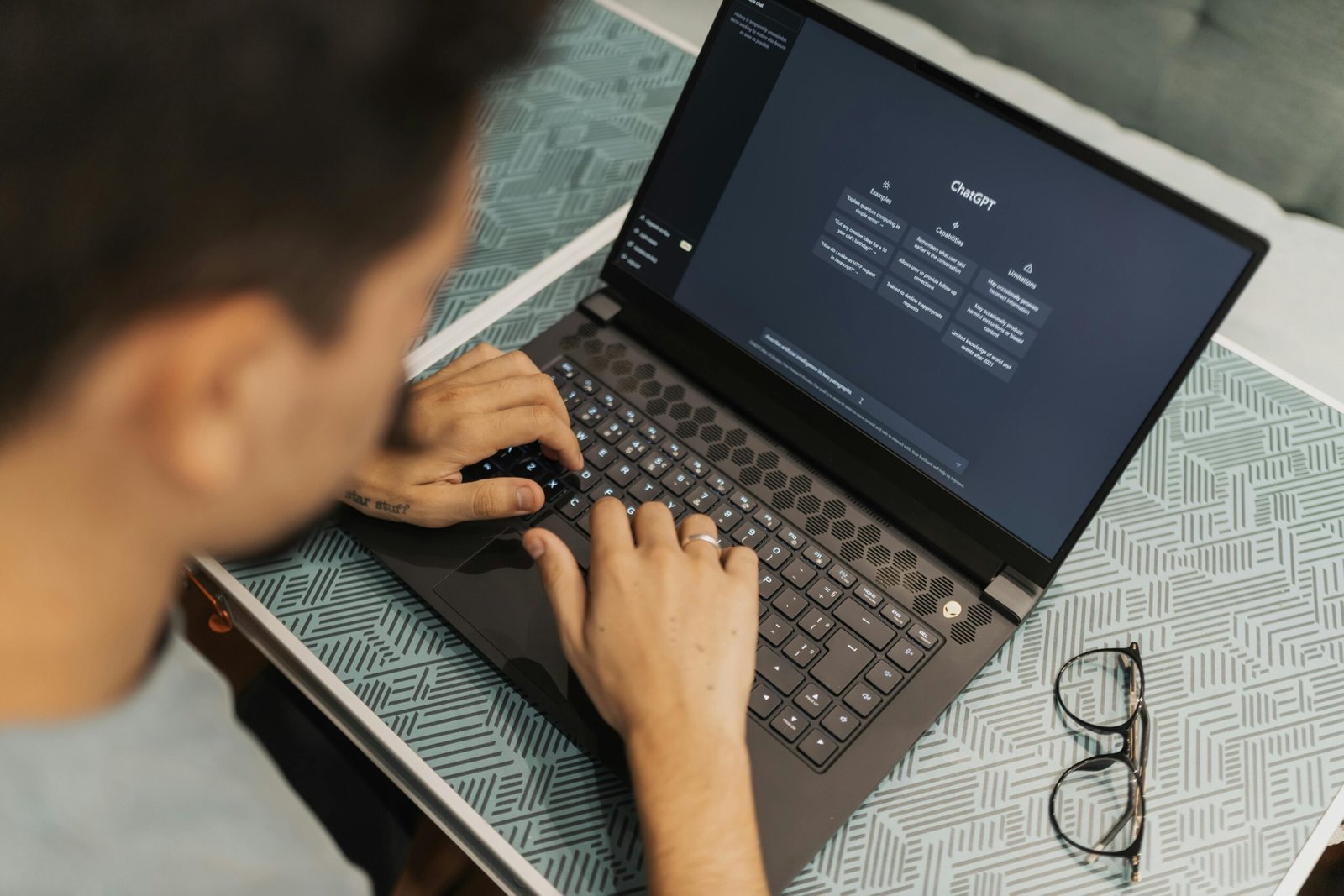 A Man Is Clicked From Back Side Seen Using AI ChatGPT Illustrating Ways to Make Money With AI