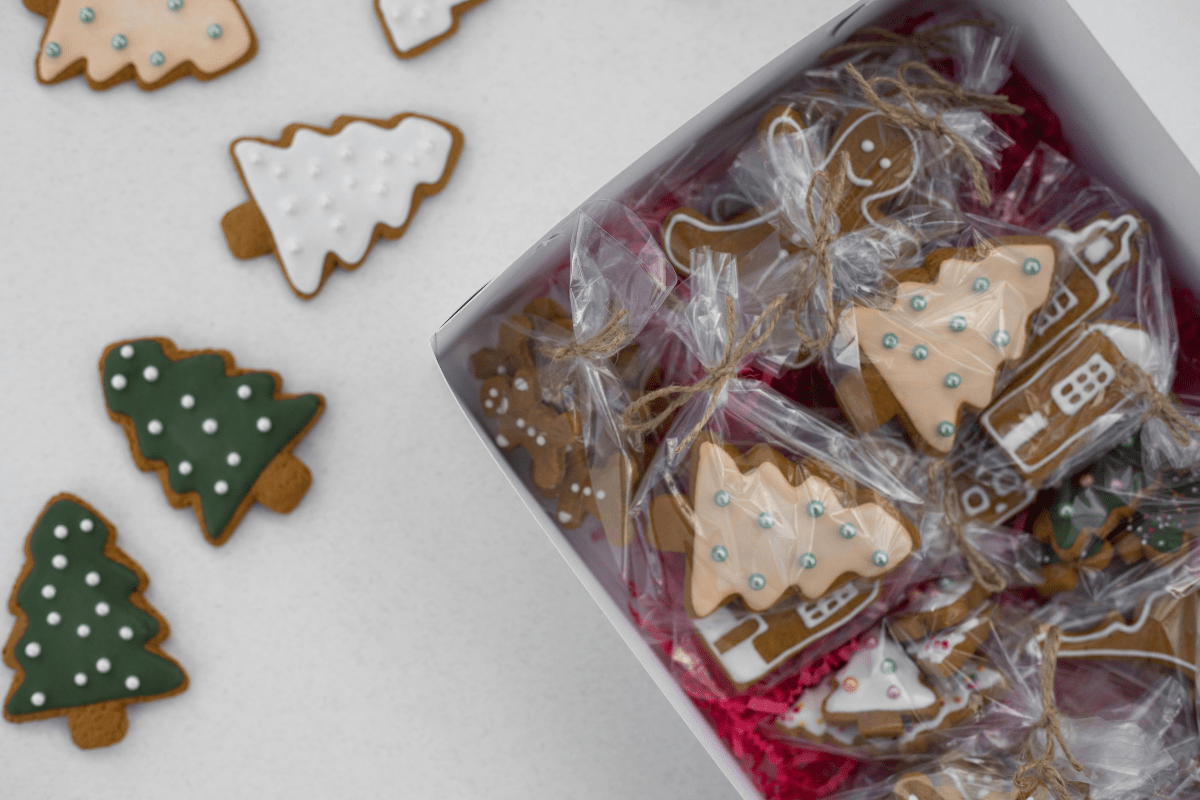 Home baked Goodies - Side Hustles for Christmas Christmas Themed Baked Goodies placed in a Box Illustrating ways to Make through Side Hustles for Christmas