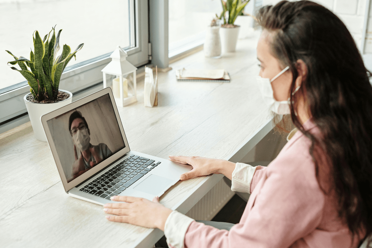 Telemedicine - Physician Side Gigs and best Side Hustles for Doctors A Doctor Can be Seen on a Video Call with a Patient Illustrating some Physician Side Gigs