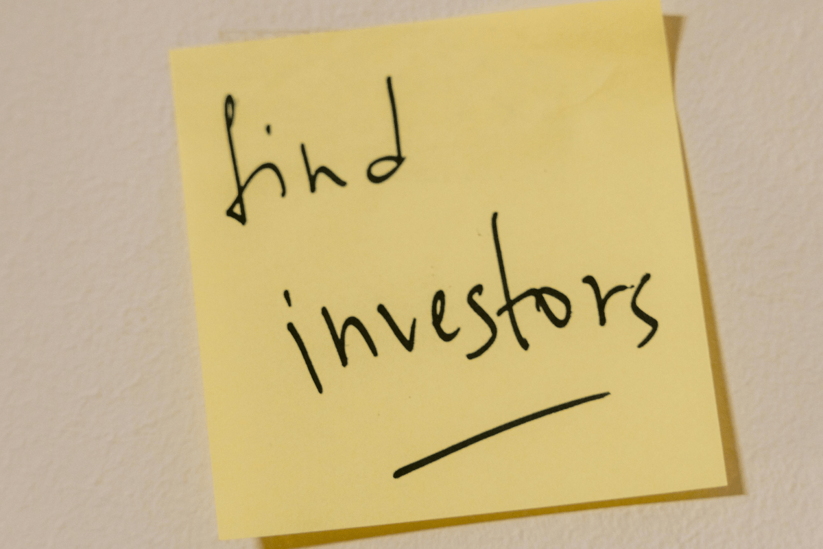 Find Investors - How to Start a Swimming Pool Cleaning Business "Find Investors" Text Written on a Sticky Note Showing How to Start a Swimming Pool Cleaning Business