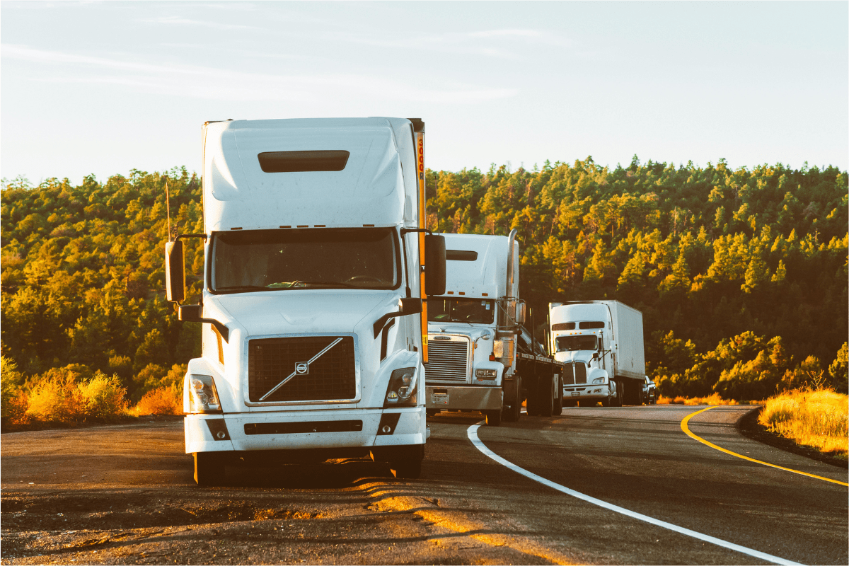 Huge Trucks Transporting Items Illustrating How to Start a Transportation Business