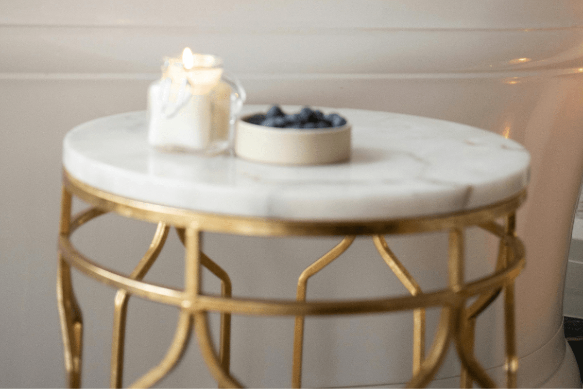 A Coffee Table With a Marble Top and Metal Stand Can be Seen Illustrating Welding Side Hustles