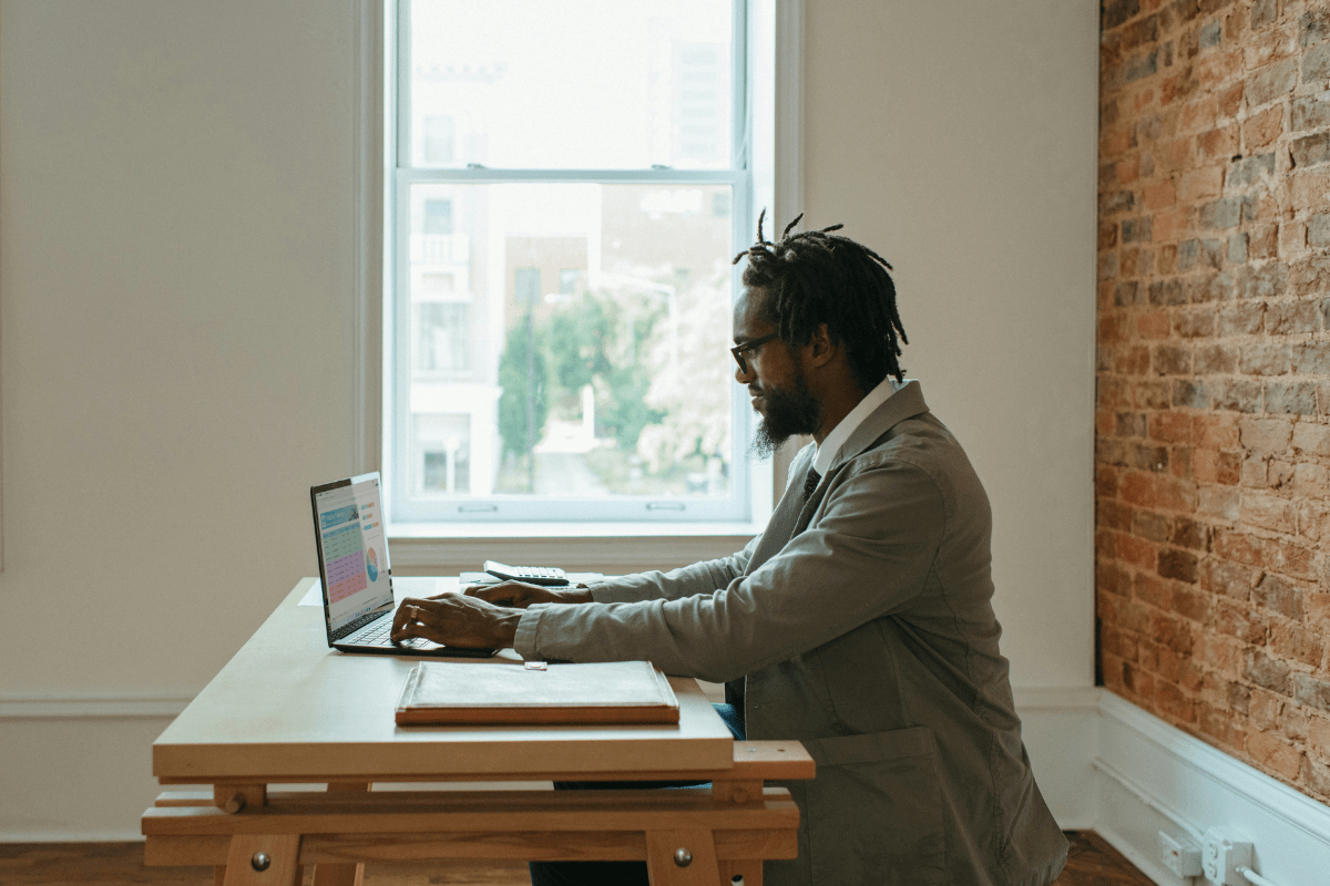 A Person Working on Their Laptop Illustrating Remote Side Hustles