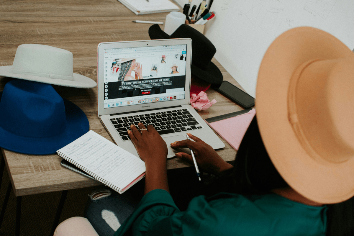 Freelancing Platforms - Side Hustle Apps A Woman Can be Seen from Backside Using Her Laptop Illustrating Side Hustle Apps