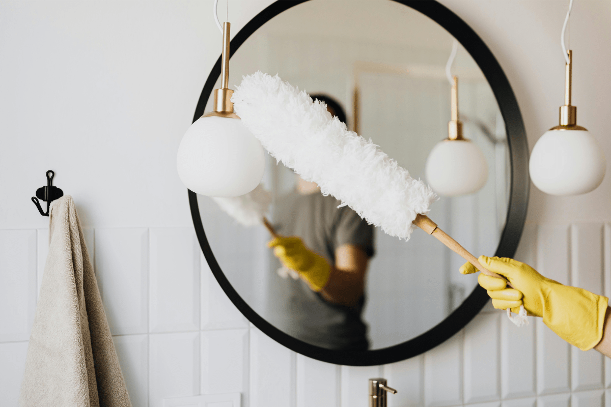 - How Profitable is a Cleaning Business - How to Start a Move Out Cleaning Business A Person's Glove Covered Hand Can Be Seen Dusting the Mirror Illustrating How to Start a Move Out Cleaning Business