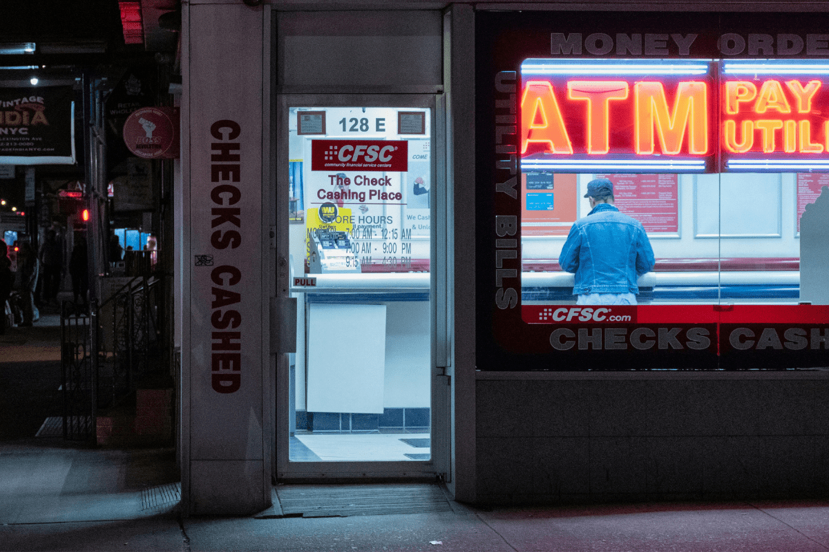 A Picture From The Outside of a Shop is Clicked with ATM Words Written in Bold Illustrating ATM Business Ideas.