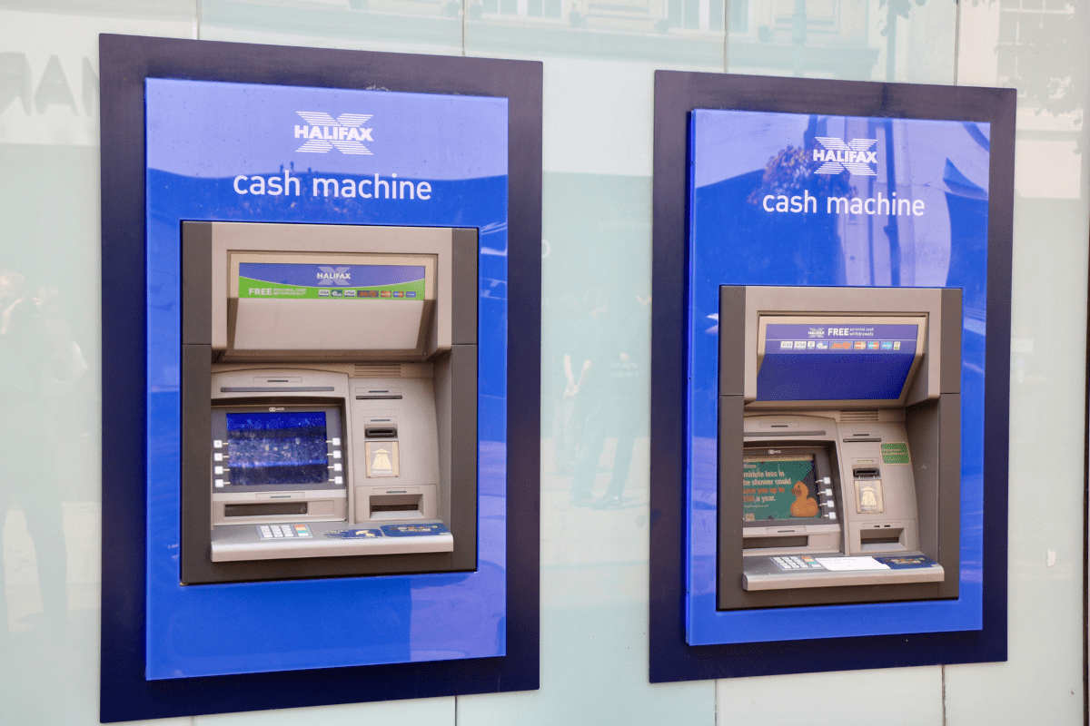 Two Cash Machines Can Be Seen Illustrating ATM Machines