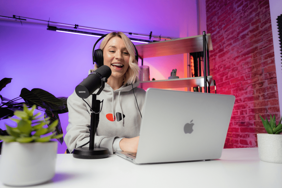 A Woman Can be Seen Speaking in a Mic While Sitting In Front of her Laptop Recording a YouTube Video Illustrating Business Ideas for Nurses