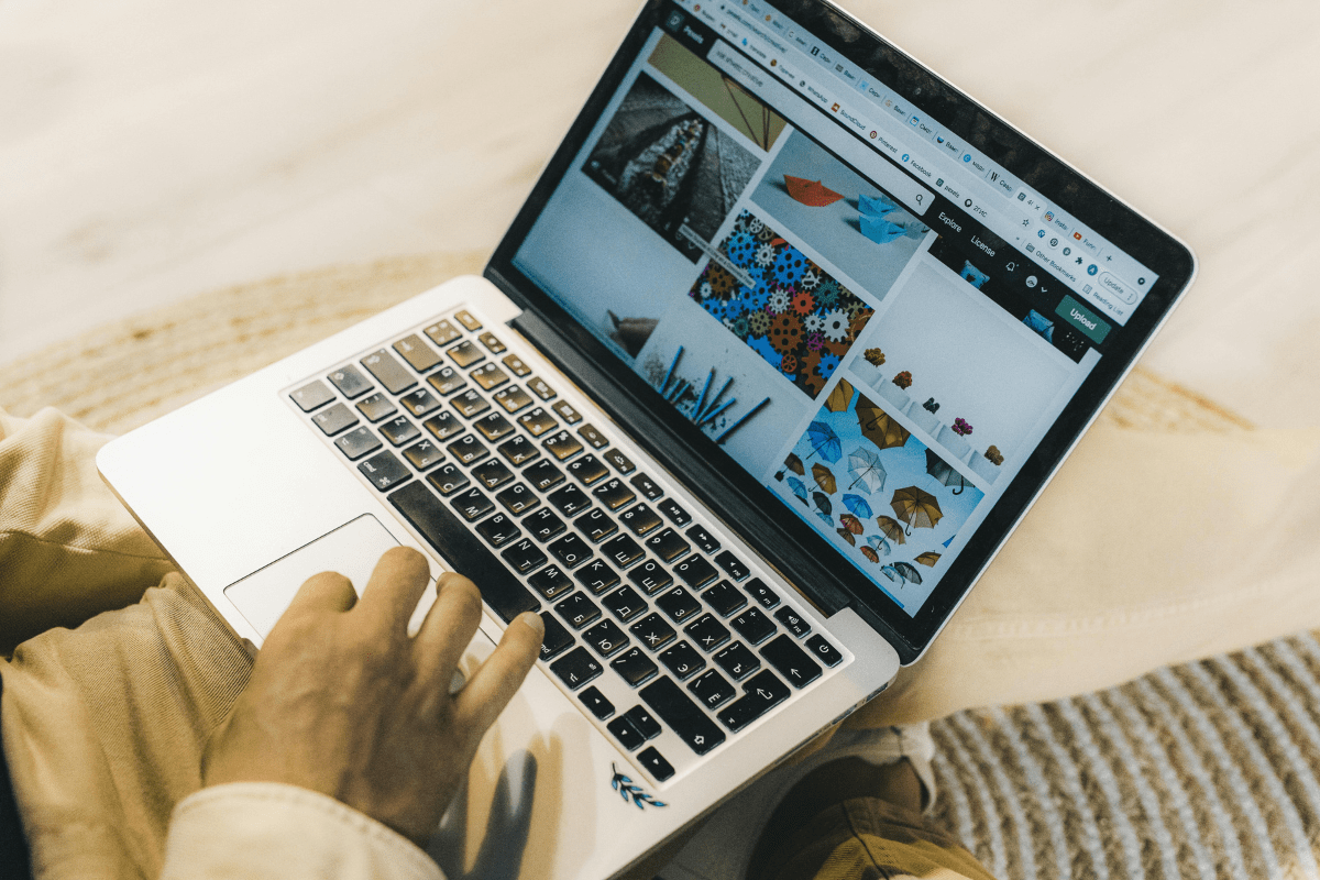 Stock Photography - Side Hustles 2025 That Need No Experience A Laptop is Placed on Table and Some Photos Can Be Seen Illustrating Side Hustles 2025 That Need No Experience