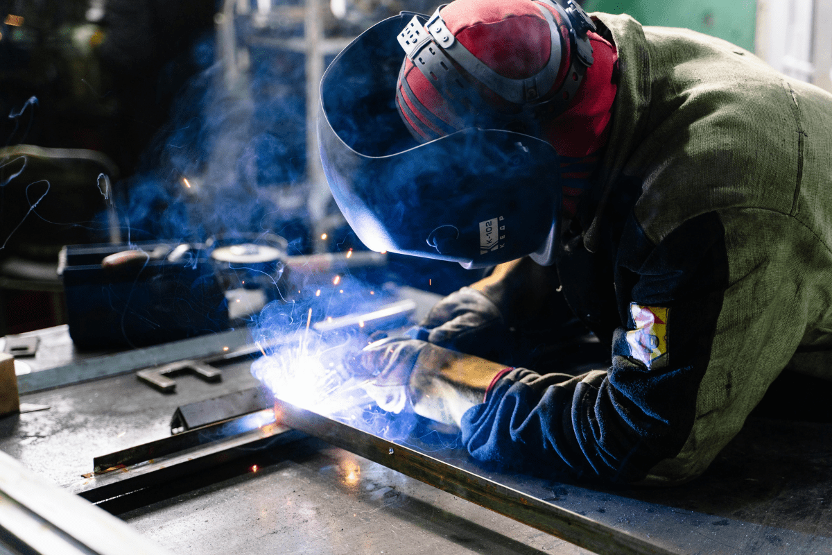 A Person Is Seen Welding Illustrating Welding Side Hustle Ideas