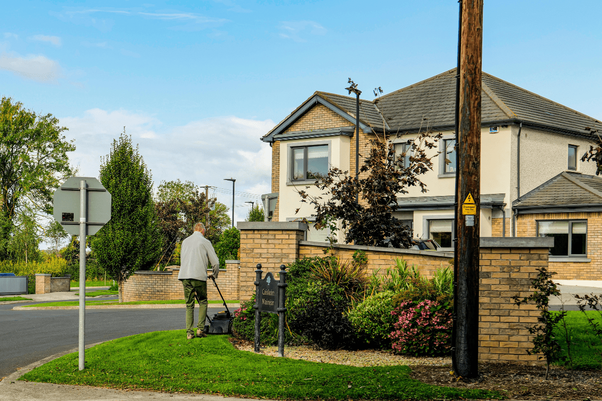 A Person Is Seen Mowing a Lawn Illustrating How to Make $100 a Day