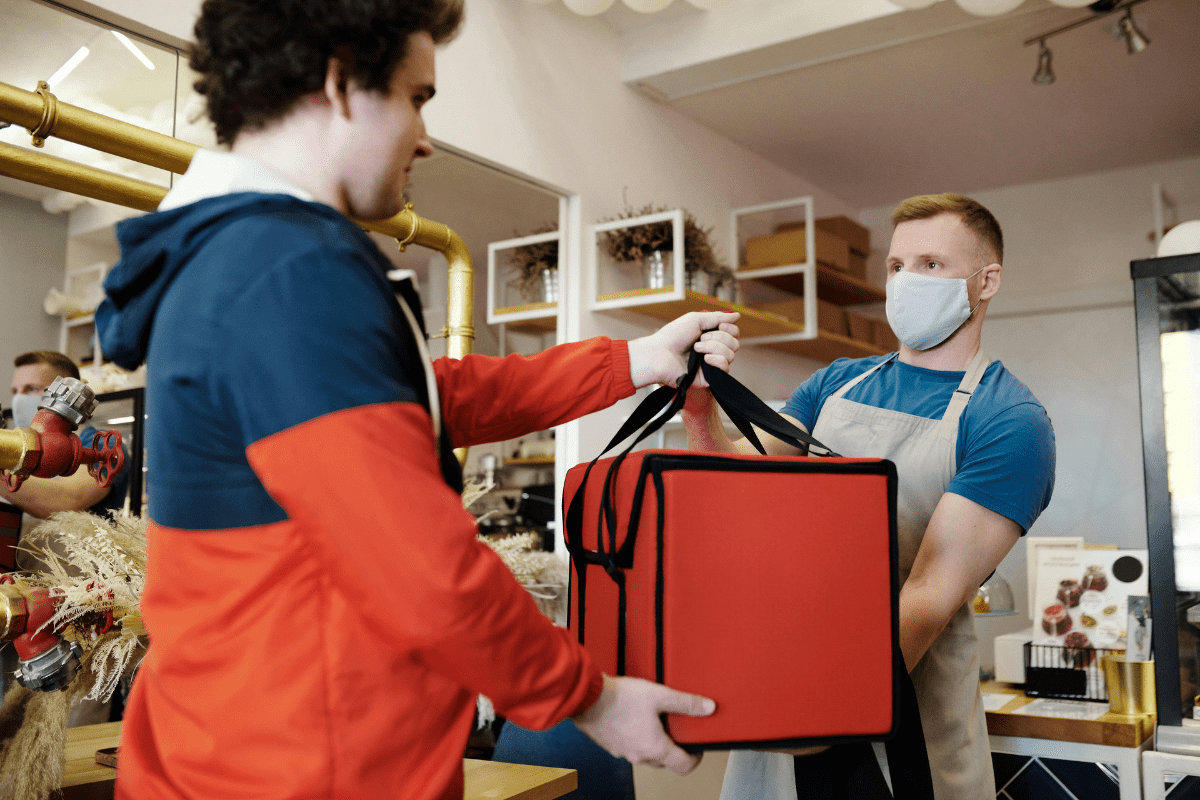 A Rider Can Be Seen Collecting Order From a Restaurant Illustrating How to Make $100 a Day