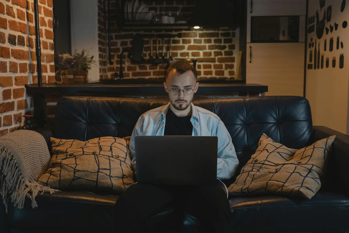 A Person Working from Home Illustrating Using AI Side Hustles to Earn Money