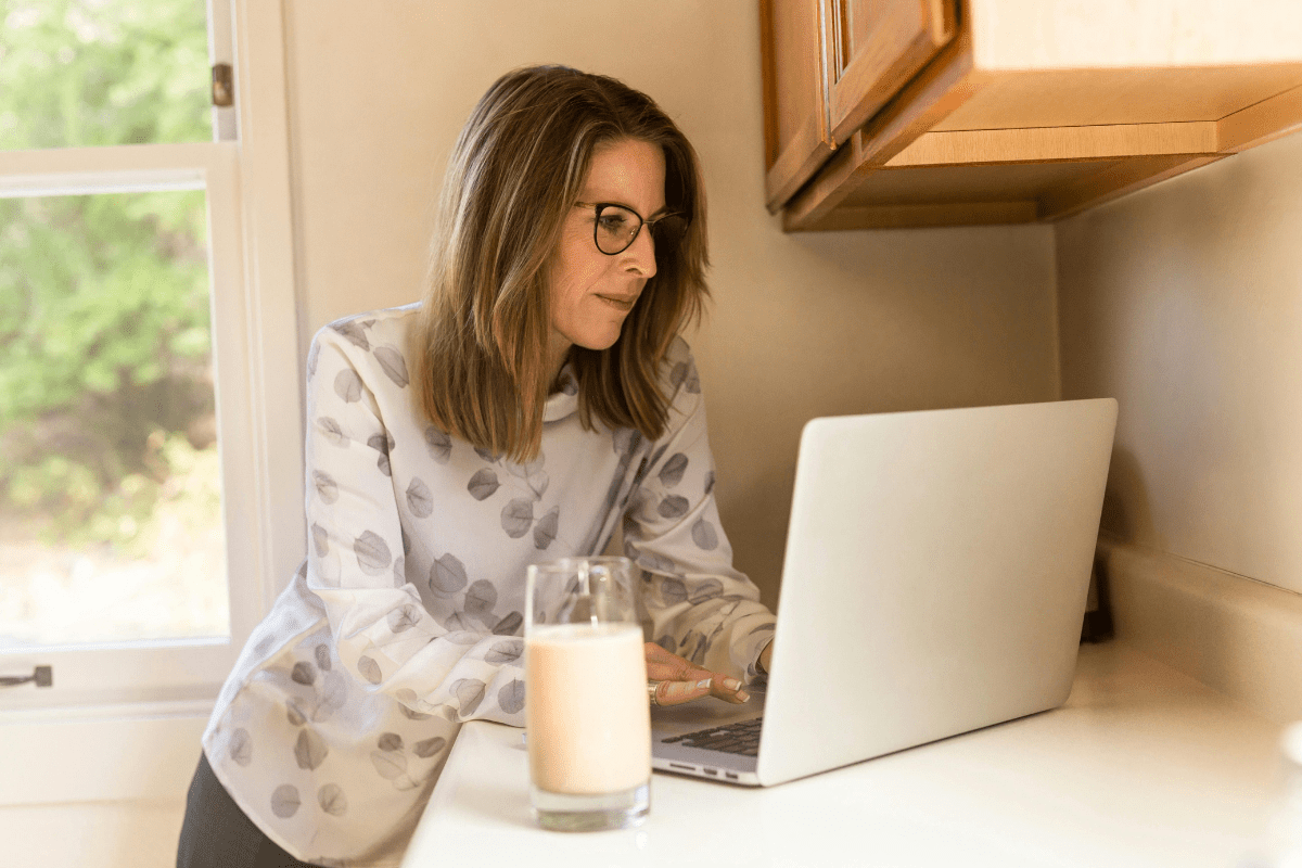 Freelance Writing - Side Hustles for Introverts A Woman Working on Her Laptop Placed on Table Top Illustrating Side Hustles for Introverts