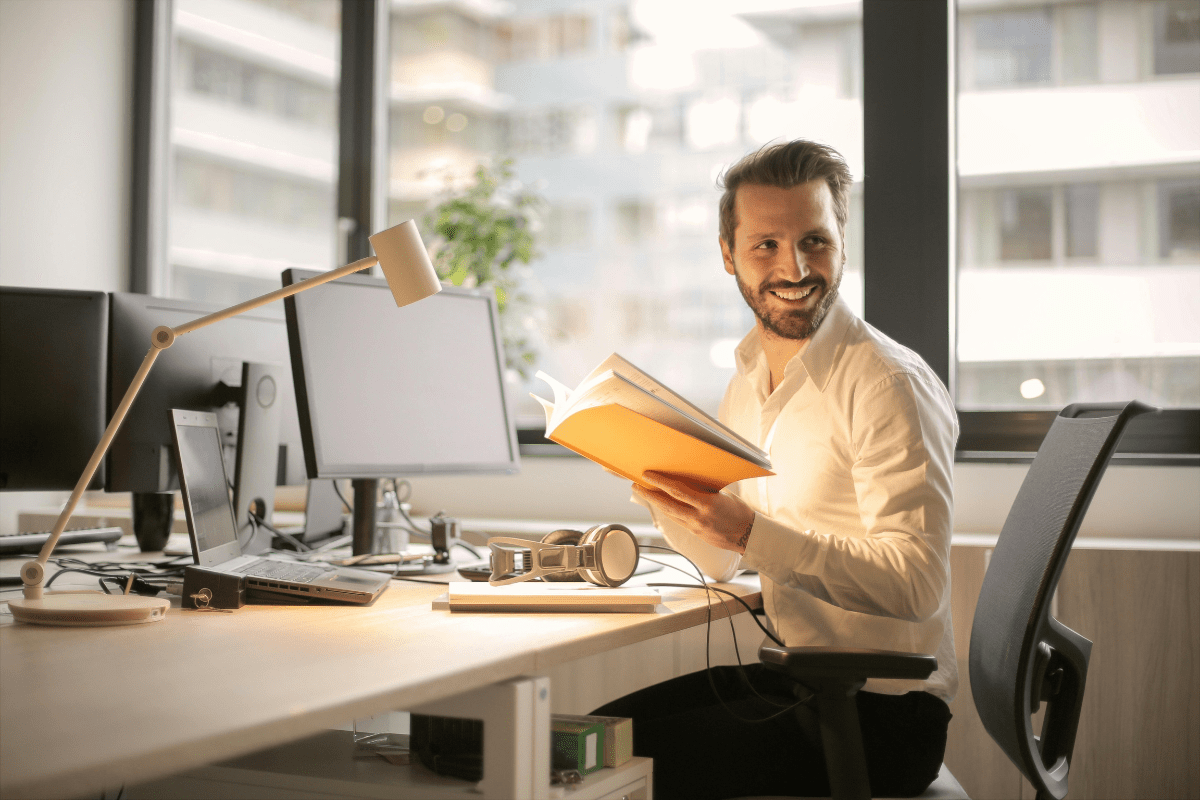 Monitor Business Credit Score - How to Build Business Credit Fast A Person Sitting In Front of Computer Monitoring His Score Illustrating How to Build Business Credit Fast