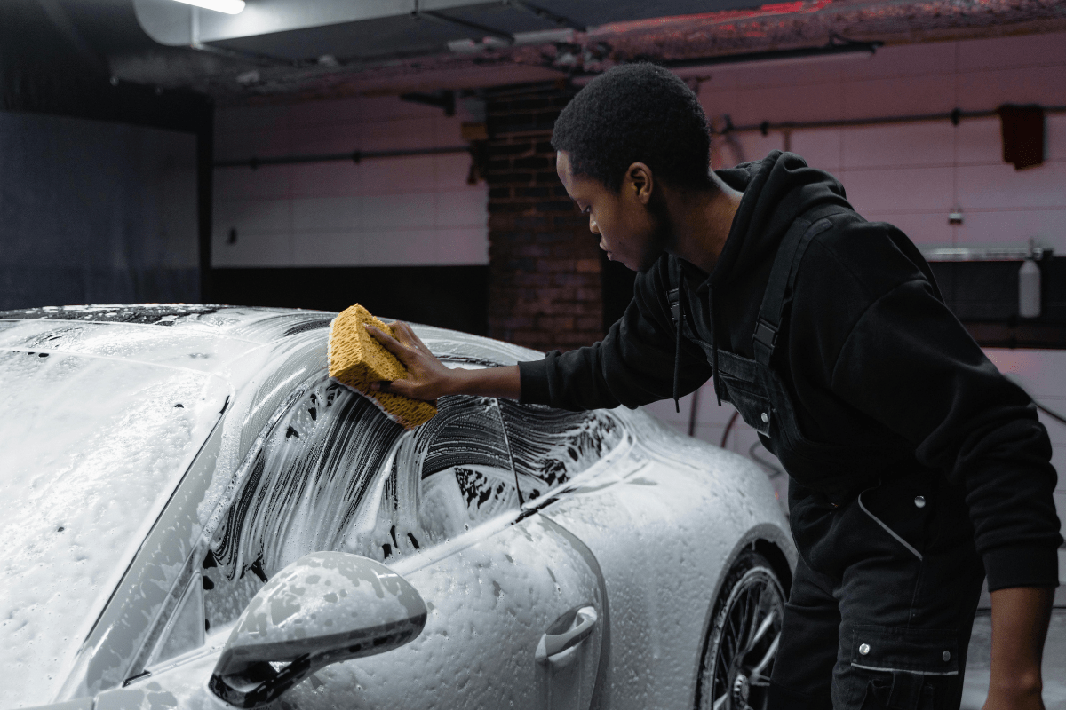 A Person Washing a Cr Illustrating Side Hustles for Men