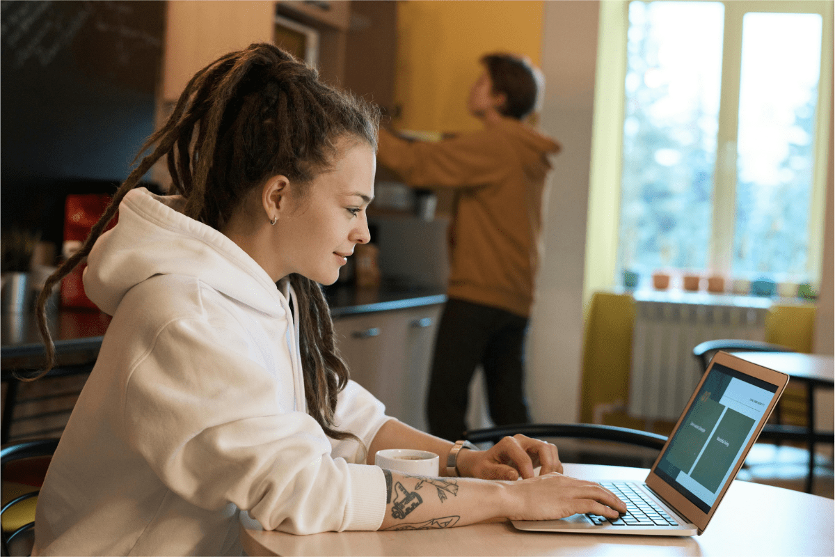 Create and Sell Apps - Best Side Hustles for Engineers A Girl is Working on Her Laptop Illustrating Best Side Hustles for Engineers